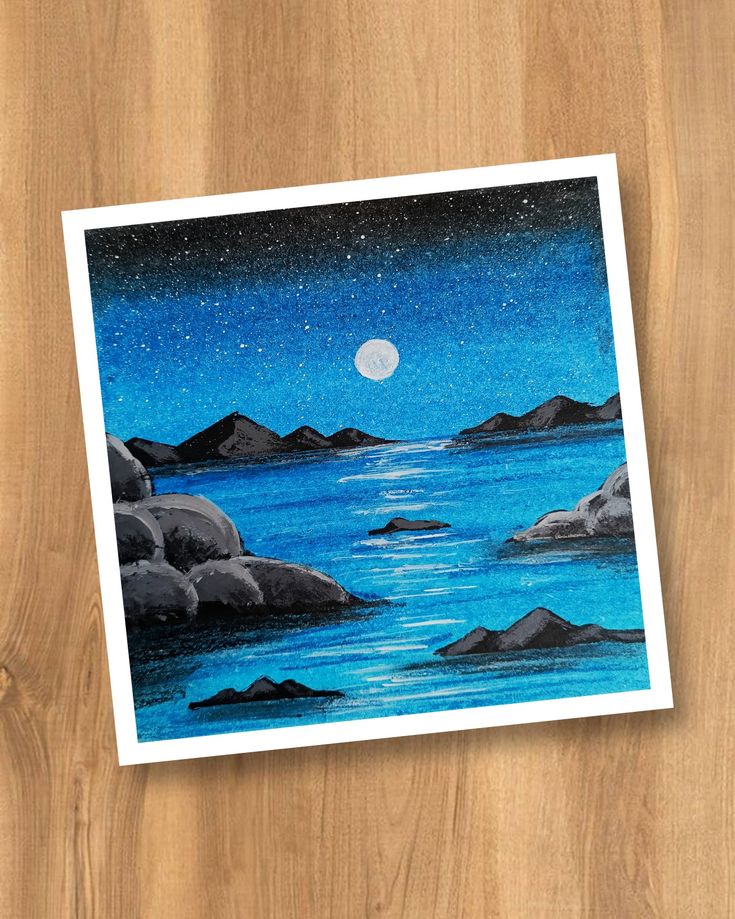 a card with an image of the ocean and mountains on it that says night time