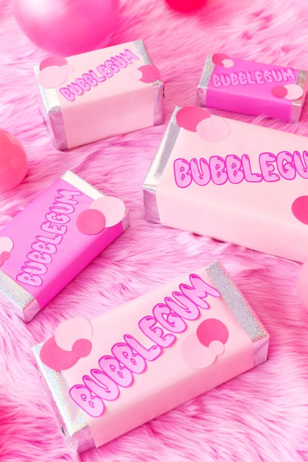 pink and silver candy bar wrappers with bubblegum written on them, surrounded by balloons