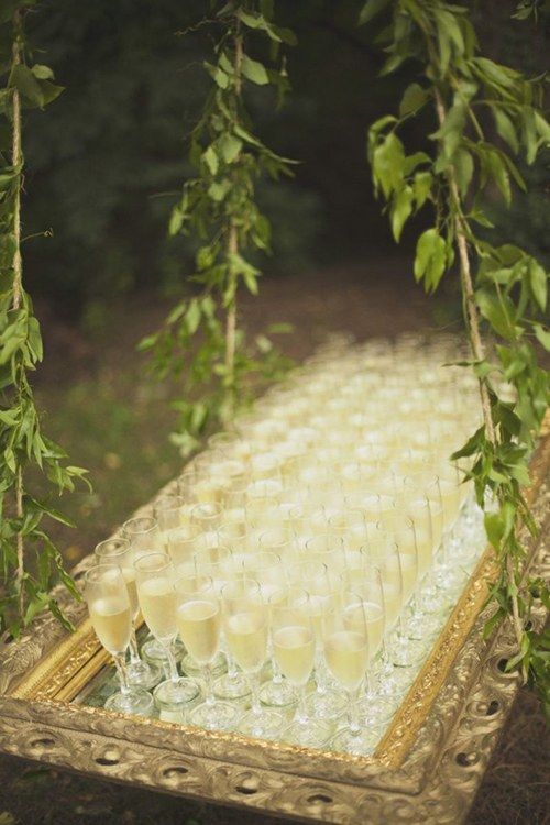 a bunch of glasses sitting on top of a table