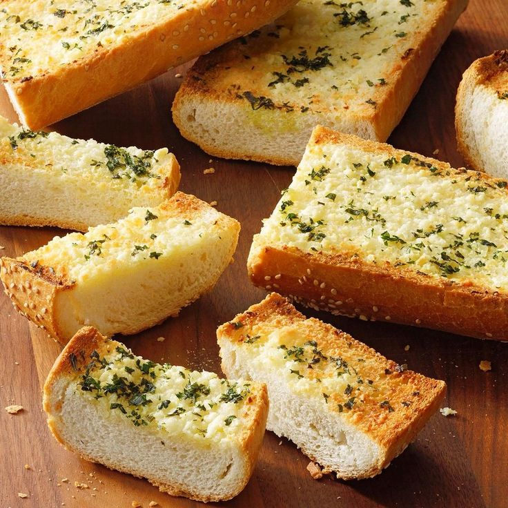 slices of garlic bread on a cutting board