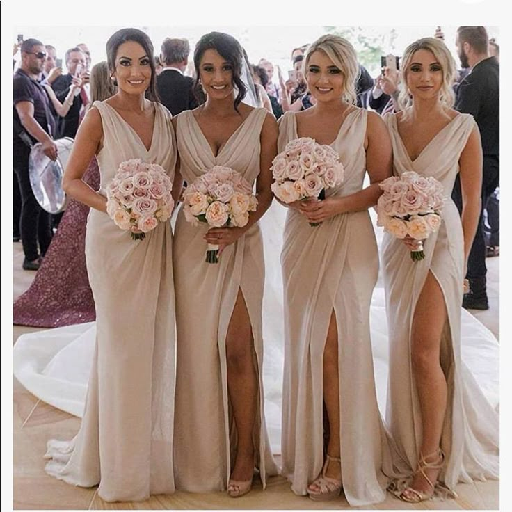 the bridesmaids are all dressed in different styles of gowns and bouquets