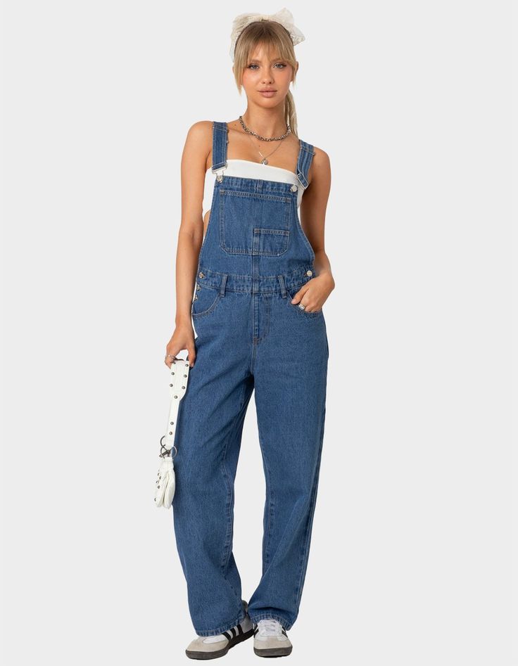 The Denim Craze Continues With These Overalls. These Overalls Are Effortlessly Casual With A Relaxed Fit For That Cool Girl Feel. Overalls. Straight Leg Fit. Button Detailing. Pockets. Belt Loops. 100% Cotton. Model Wears Size S. Model Height Is 5'6. Item Care: Machine Wash At Maximum Of 30ºc, Do Not Bleach, Tumble Dry Low, Iron At A Maximum Of 110ºc, Do Not Dry Clean. | Edikted Rosemary Denim Overalls Cute Overalls, Wwe T Shirts, Flannel Sweatshirt, Girls Overalls, Girls Graphic Tee, Girls Blouse, Denim Overalls, Sweaters And Jeans, Low Iron