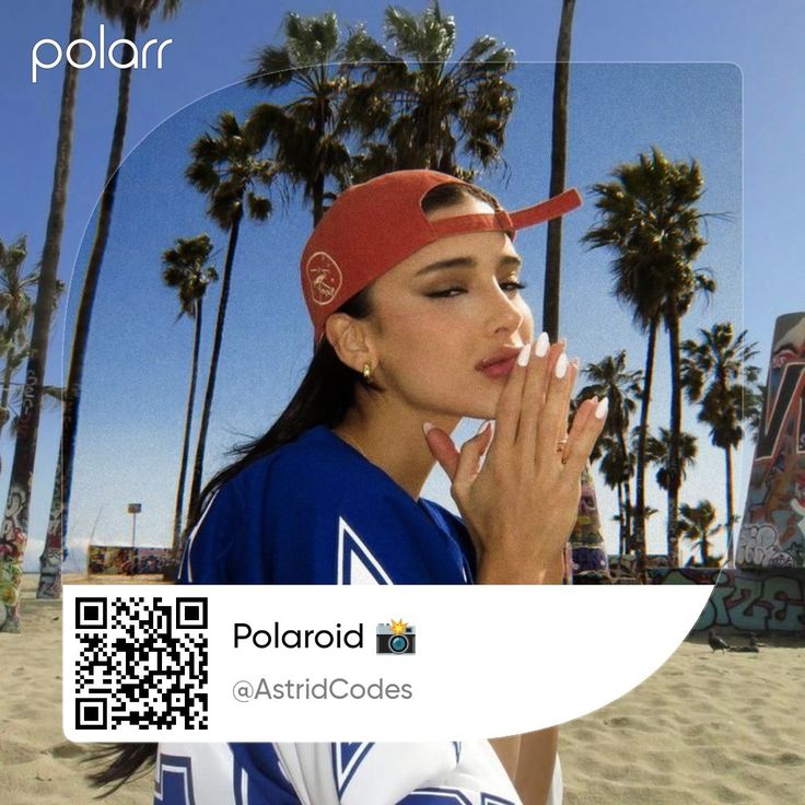 a woman is blowing her nose while standing on the beach with palm trees in the background