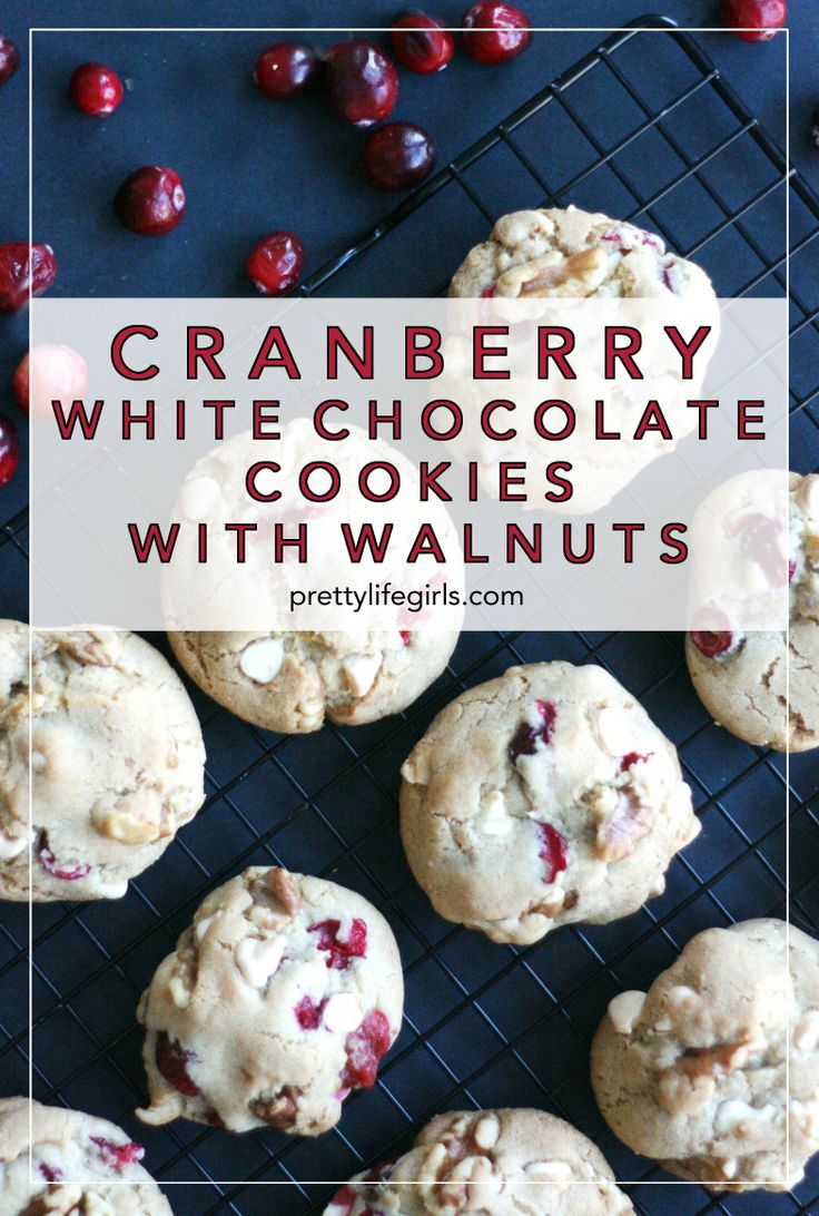 cranberry white chocolate cookies with walnuts on a cooling rack and cherries