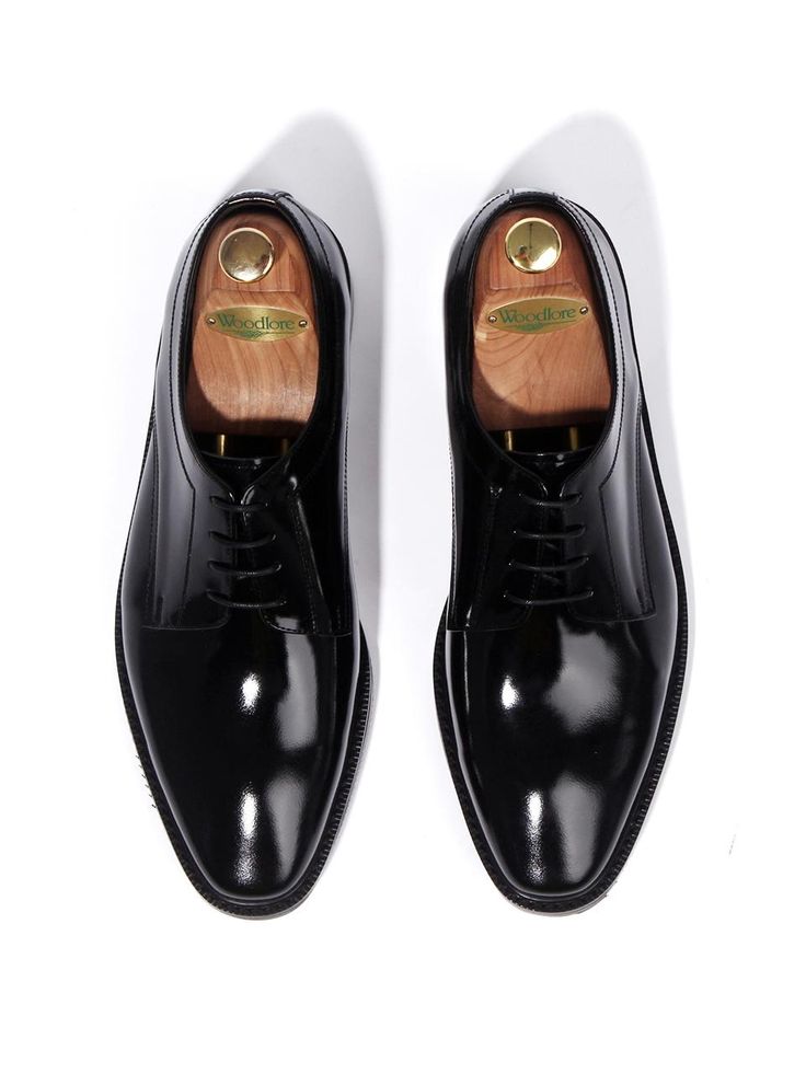 It is a classic derby shoes in sophisticated design. The straight shape, square toe at the tip, and clean silhouette makes a stylish shoes.- Glossy black box leather- Italian Casta sole- Straight fit Black Square Toe Oxfords For Business, Luxury Square Toe Leather Shoes For Business, Elegant Black Square Toe Oxfords, Business Dress Shoes With Leather Sole And Square Toe, Elegant Formal Oxfords With Square Toe, Timeless Black Derby Shoes For Semi-formal Occasions, Luxury Leather Shoes With Square Toe For Formal Occasions, Formal Leather Oxfords With Square Toe, Classic Black Patent Leather Shoes