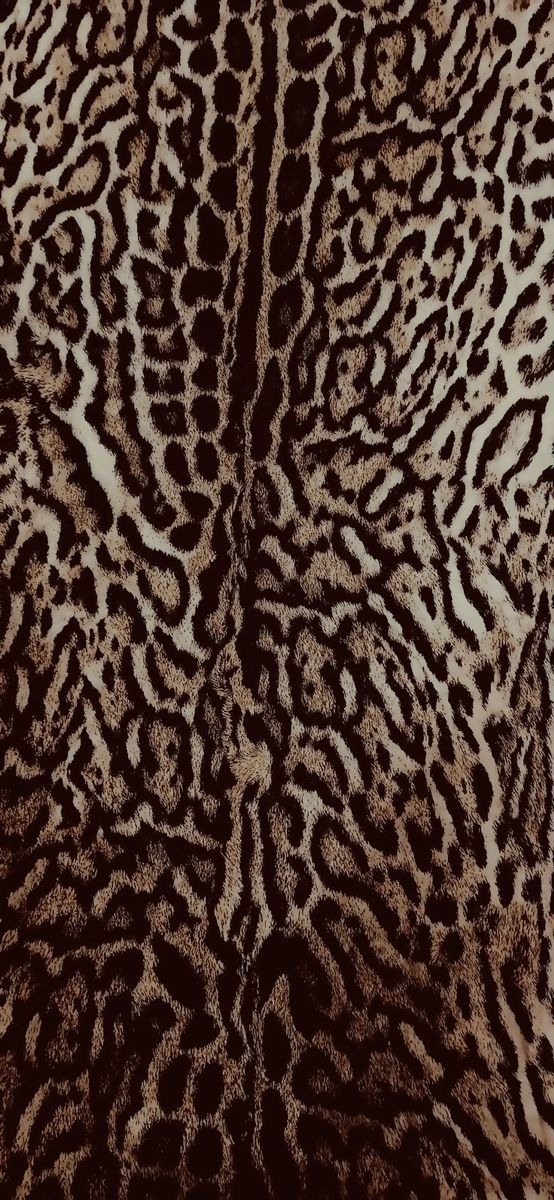 an animal print pattern is shown in brown and white