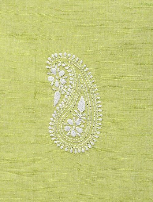 an embroidered paisley design on a green fabric with white thread and sequins in the center