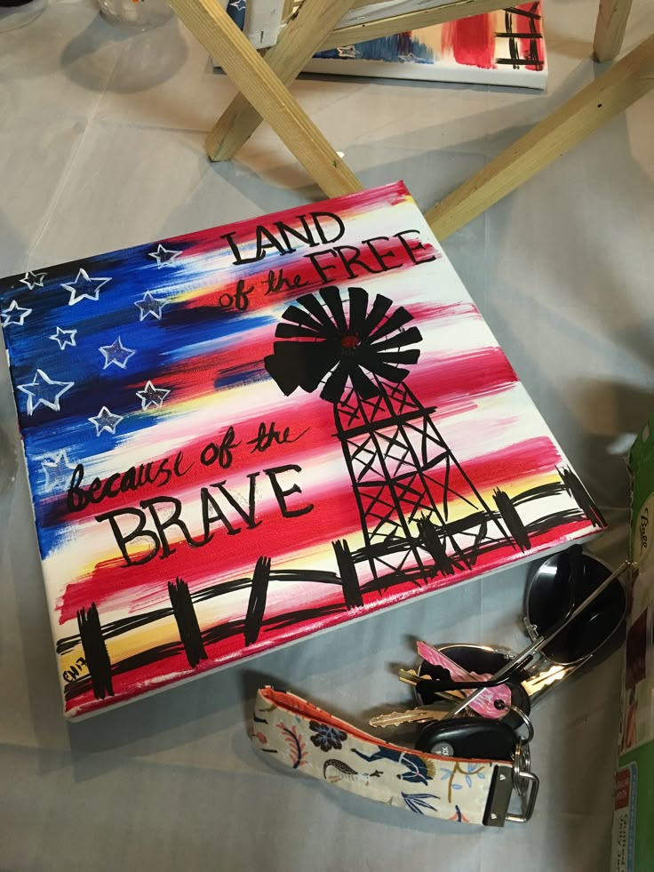 a book with the words land of the free and an american flag painted on it