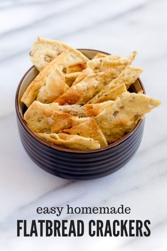 homemade flatbread crackers in a bowl with the text overlay reading easy homemade flatbread crackers