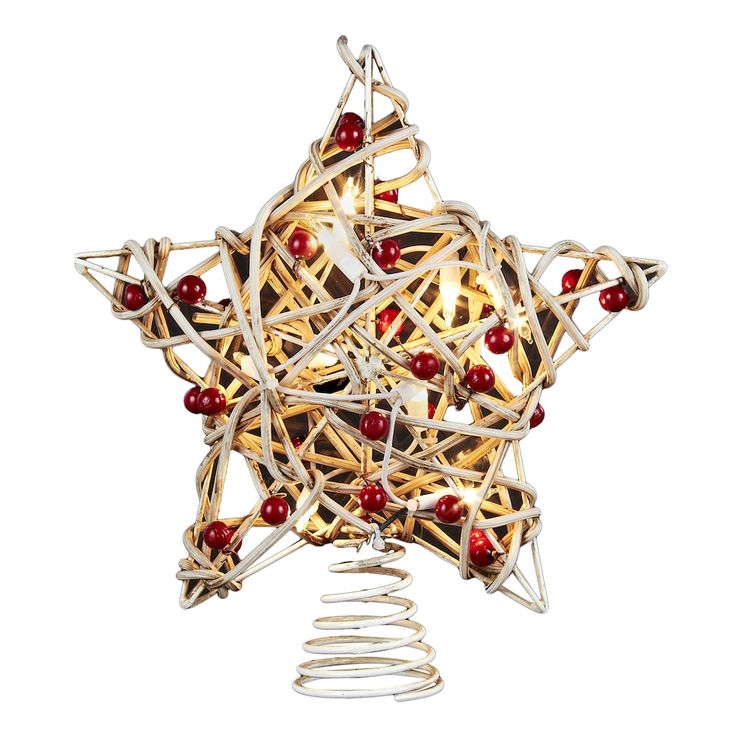 a christmas ornament made out of string and wood sticks with red berries on it