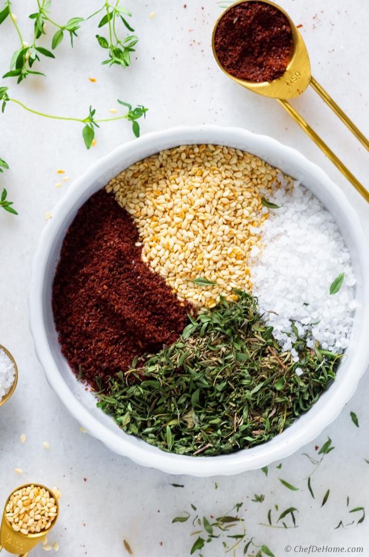 an overhead view of spices and seasonings in a bowl