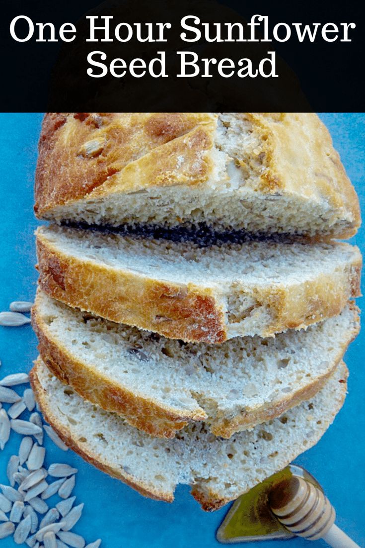 a loaf of sunflower seed bread on top of a blue table