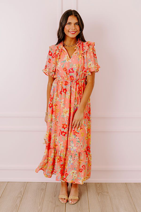 - Drape yourself in petals and twirl in the sun with this airy dress! - Chiffon material with a colorful abstract floral print - A built-in lining that ends above the ruffled hemline - A ruffled v-cut neckline with a tie detail - Short, loose ruffled sleeves - Pleated detail at the bodice - An elastic waistline - A flowy yet flattering silhouette that ends in a ruffled maxi length hemline Airy Dress, Abstract Floral Print, Chiffon Material, Ruffled Sleeves, V Cuts, Abstract Floral, Bodice, Coral, Chiffon