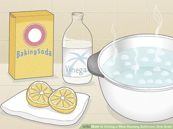 a bowl of water, lemon slices and baking soda