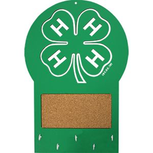 a cork board with the letter h and four leaf clover on it, in white lettering