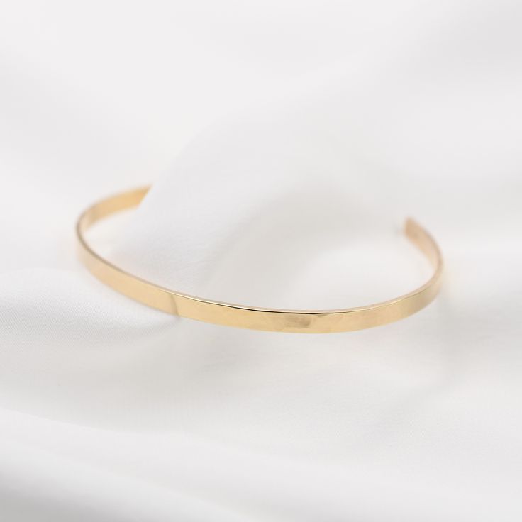 "14K gold cuff bracelet. 14K Gold Minimalist Cuff Bracelet * 14K solid gold. It is about 3mm x 1mm Please select the size of your wrist. If your wrist is 6\", please purchase 6\" bracelet. (If you order a 6\" bracelet, actual cuff length will be 5\" plus 1 inch opening.) Please read our policies before you place your order. https://www.etsy.com/shop/SashJewelry/policy?ref=shopinfo_policies_leftnav To see other Mother daughter necklace set click here: https://www.etsy.com/shop/SashJewelry?section Adjustable Minimalist 14k Gold Bangle, Minimalist Rose Gold Bracelet With Polished Finish, Minimalist Polished Rose Gold Bracelet, Minimalist Yellow Gold Cuff Bracelet For Formal Occasions, Minimalist Yellow Gold Cuff Bracelet For Everyday, Minimalist Yellow Gold Everyday Cuff Bracelet, Minimalist 14k Gold Bangle, Minimalist Rose Gold Bangle With Polished Finish, 14k Gold Polished Minimalist Cuff Bracelet