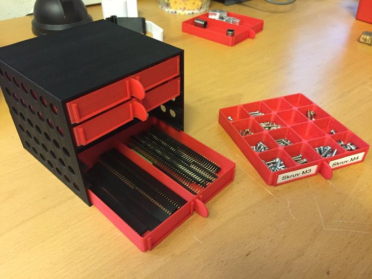 an open tool box sitting on top of a wooden table