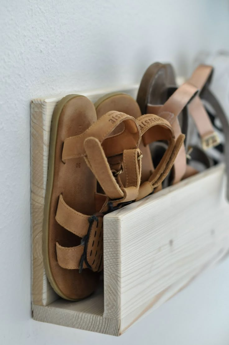 there are many pairs of shoes in the shoe rack