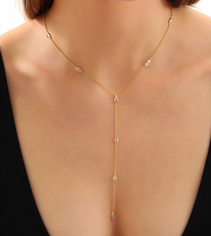 Lariat Necklace,14K Gold Minimalist Y Necklace,Long Necklace,Aesthetic Necklace,Layered Necklace,Christmas gifts,Birthday Gifts,Gift for Her Made of 925 Sterling Silver 14k Gold Filled Drop Zircon Stone Lariat,Y Necklace Enhance your style with this stunning lariat necklace, crafted from high-quality 925 sterling silver and plated in luxurious 14k gold. The delicate drop design features a sparkling zircon stone, adding a touch of timeless elegance and sophistication to any outfit. Whether you're Dainty Long Backdrop Necklace With Clavicle Chain, Minimalist Dangle Necklaces For Parties, Gold Y-shape Necklace For Formal Occasions, Formal Long Drop Necklaces With Delicate Chain, Formal Long Drop Necklace With Delicate Chain, Minimalist Long Backdrop Necklace With Adjustable Chain, Formal Gold Y-shaped Necklace, Elegant Lariat Charm Necklace With Chain, Elegant Lariat Charm Necklace