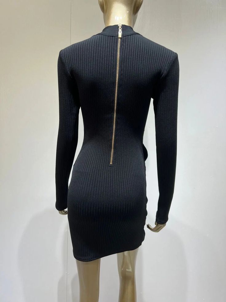 A sassy take on the classic turtleneck dress, this Terina Long Sleeve Mesh Bandage Dress is sure to turn heads. Its bandage ribbed fabric and eye-catching gold zipper make it a fabulous choice for any cold-weather outing. Plus, the asymmetrical mesh inserts add a touch of show-stopping sexiness! So grab your boots and statement earrings and get ready to party. Silhouette: Sheath Material: Nylon, Spandex Closure Type: zipper Sleek Ribbed Party Dress, High Neck Ribbed Party Dresses, Chic Stretch Bodycon Dress With Zipper Closure, Chic High Stretch Bodycon Dress, Winter Party Turtleneck Bodycon Dress, Ribbed High Neck Party Dress, Ribbed High Neck Dress For Party, Ribbed Fitted Bodycon Dress For Party, Ribbed Bodycon Dress For Party