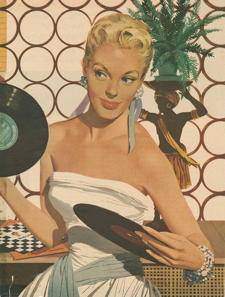 a woman in a white dress holding a record