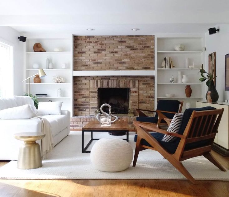 a living room filled with furniture and a fire place