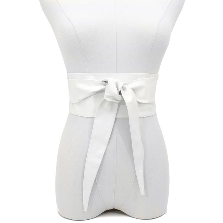 Indulge in the luxurious feel of our Obi Wrap Belt in White, crafted from buttery soft Italian leather. Made from premium Italian leather, this belt is smooth to the touch and designed to flatter your figure. The 3 3/4" width in the front gracefully tapers to a comfortable fit in the back, ensuring a stylish and secure look all day long. Unlike stiff belts that can dig in, this Italian leather belt conforms to your curves for ultimate comfort. Leather Party Belts, Elegant Fitted Belt With Removable Feature, Spring Evening Corset Belt, Modern White Belt For Formal Occasions, Formal Belts For Spring, Elegant Faux Leather Corset Belt, Chic Leather Corset Belt For Party, Elegant White Leather Belt, Chic Belted Corset Belt For Spring