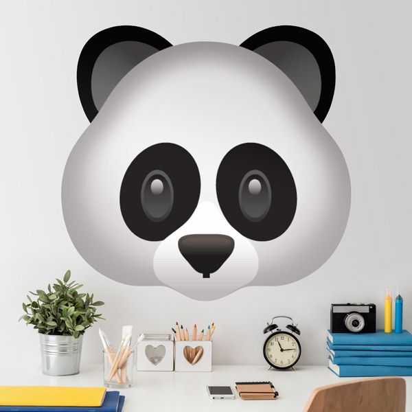 a panda face with big eyes on a white wall