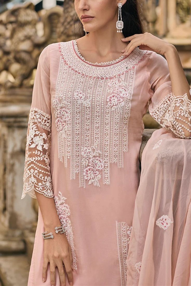 This exquisitely designed soft organza pant style suit Pakistani Suit is embellished with delicate resham, beads, sequins, and lace work, making it a standout piece for any occasion. From festive celebrations to social gatherings and cultural events, this pant suit showcases the ultimate combination of style and grace.      Fit:   Slim Fit (more fitted and snug at bust area)      Top: Soft Organza Silk    Bottom: Blended Silk    Dupatta: Embroidered Organza Silk    Embroidery resham thread, bead Suit Organza, Sharara Suit Pakistani, Phulkari Pants, Area Top, Lucknowi Kurta, Gharara Suits, Patiala Salwar Suits, Thread Beads, Suit Pakistani