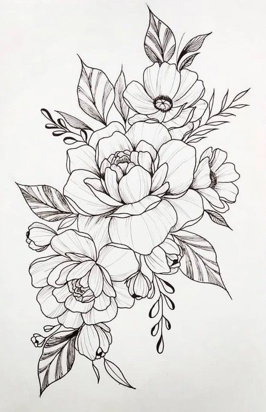 some flowers and leaves on a white paper next to markers, pens and pencils