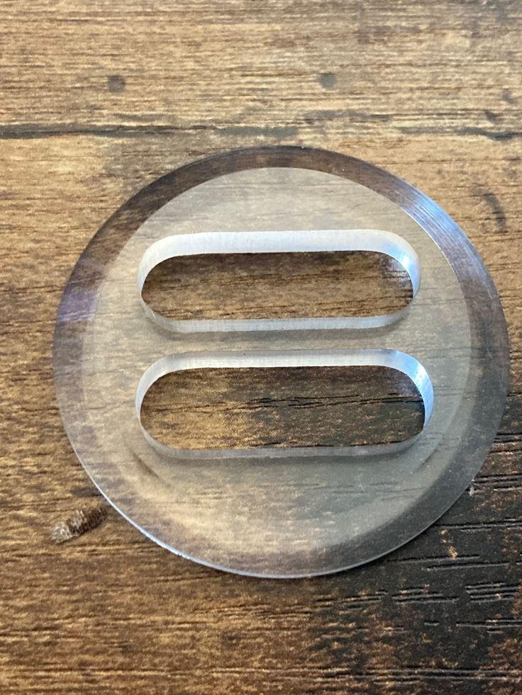 a metal object sitting on top of a wooden table