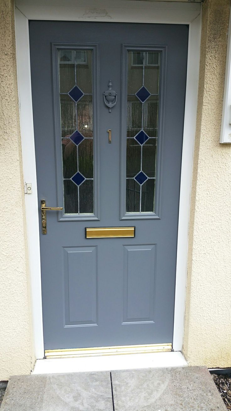 a blue front door with two glass windows