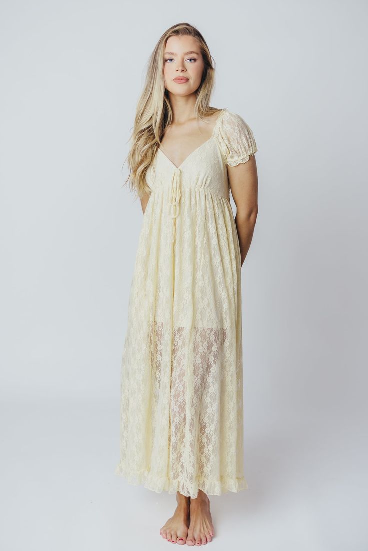 Slip on this maxi dress for an instantly-elevated outfit - the Lindsey is all lace and no fuss. We love its delicate vintage lace overlay, combined with a sweetheart neckline and puffed sleeves. It's a beautiful, feminine choice for any occasion! Available in two colorways. FIT: Runs true to size. MATERIAL: Self: 90% Nylon, 10% Spandex; Lining: 100% Rayon. GARMENT DETAILS: Lightweight maxi dress with an inverted empire waist silhouette. Features a low sweetheart neckline, ruffled short sleeves, and a self-tie ribbon accent at the bust. Finished with a flounced ruffled hem, and smocked back panel. Partially lined with mini-skirt length lining. SIZE GUIDE: S (2-4) / M (6-8) / L (10-12) MODEL DETAILS: Mackenzie - Size S Heather - Size S Molly - Size XL Our Brunette Misses Model Our Blonde Mis Tie Ribbon, Curve Model, Garment Details, Dress With Ruffles, Ruffle Shorts, Lace Maxi, Lace Maxi Dress, Puffed Sleeves, Lace Overlay