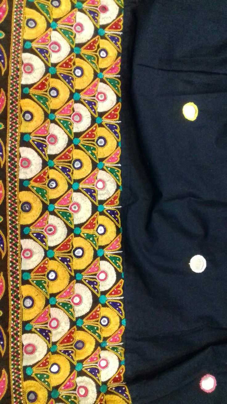 two pieces of cloth with different designs on the side and one has buttons in it