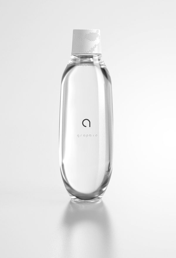 an empty glass bottle on a white surface