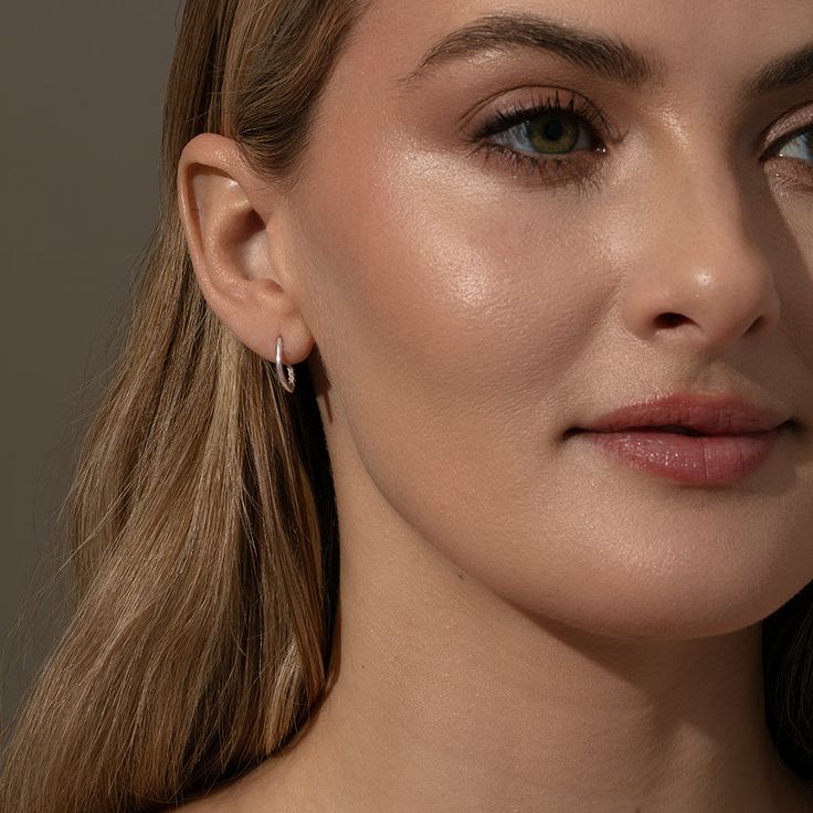 Meet the earring that does it all — the Hidden Pavé Stud Earrings. Not only are they a cross between stud earrings and mini hoop earrings, but they also balance simple and shine. At first glance these seem to be a pair of simple earrings, but if you look closer there’s a row of pavé peeking out from inside the hoop. For more pieces that add some shine to your look, shop our Just Add Sparkle Collection. Classic Drop Cartilage Earrings With Matching Set, Classic Drop Cartilage Earrings, Elegant Tarnish Resistant Piercings, Everyday Rose Gold Huggie Earrings, Elegant Small Hoop Wrap Earrings Hypoallergenic, Minimalist Rose Gold Hoop Earrings For Everyday, Elegant Hypoallergenic Small Hoop Wrap Earrings, Minimalist Single Plug Earring For Everyday, Everyday Hypoallergenic Drop Wrap Earrings