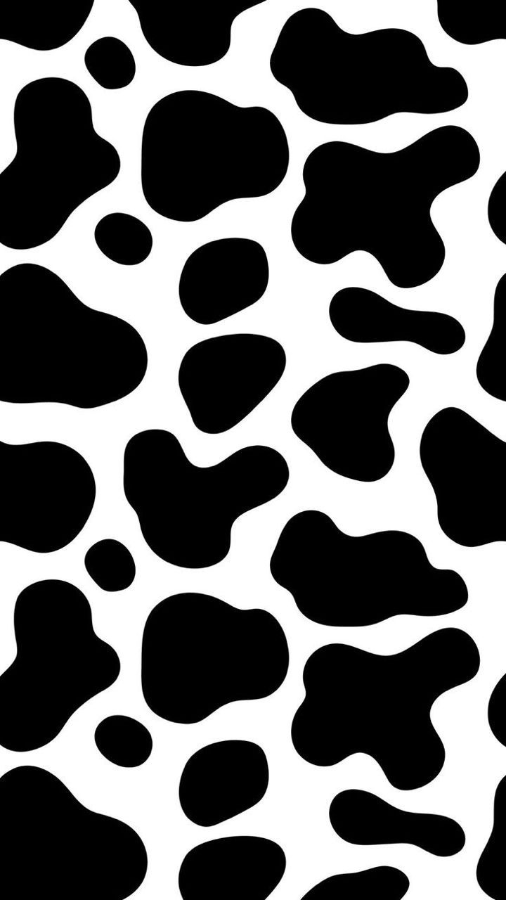 a black and white animal print pattern that looks like it has spots on the skin