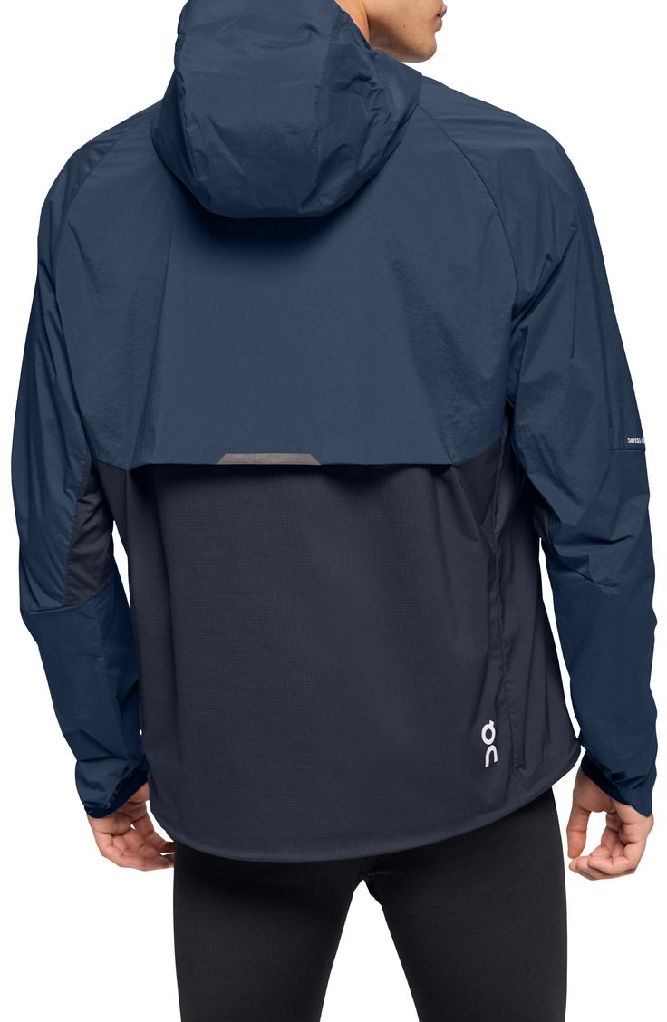 Enjoy the versatility of a lightweight, wind-resistant running jacket designed with a stay-put hood and secure zip pockets. 28 1/2" length (size Medium) Front zip pockets Drawstring hood Partial elastic cuffs with top extension On-seam zip pockets Drawstring hem Packs into pocket Reflective details enhance visibility in low light or at night Lined 87% Recycled polyamide 13% elastane Machine wash, tumble dry Imported Sportswear Details, Running Apparel, Sports Graphic Design, Jackets Men Fashion, Light Knit, Running Jacket, Water Repellent Fabric, Saint Bernard, Running Clothes