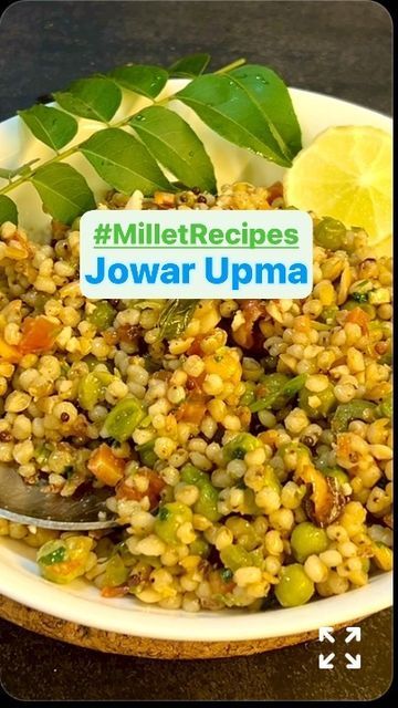 a white bowl filled with corn and vegetables