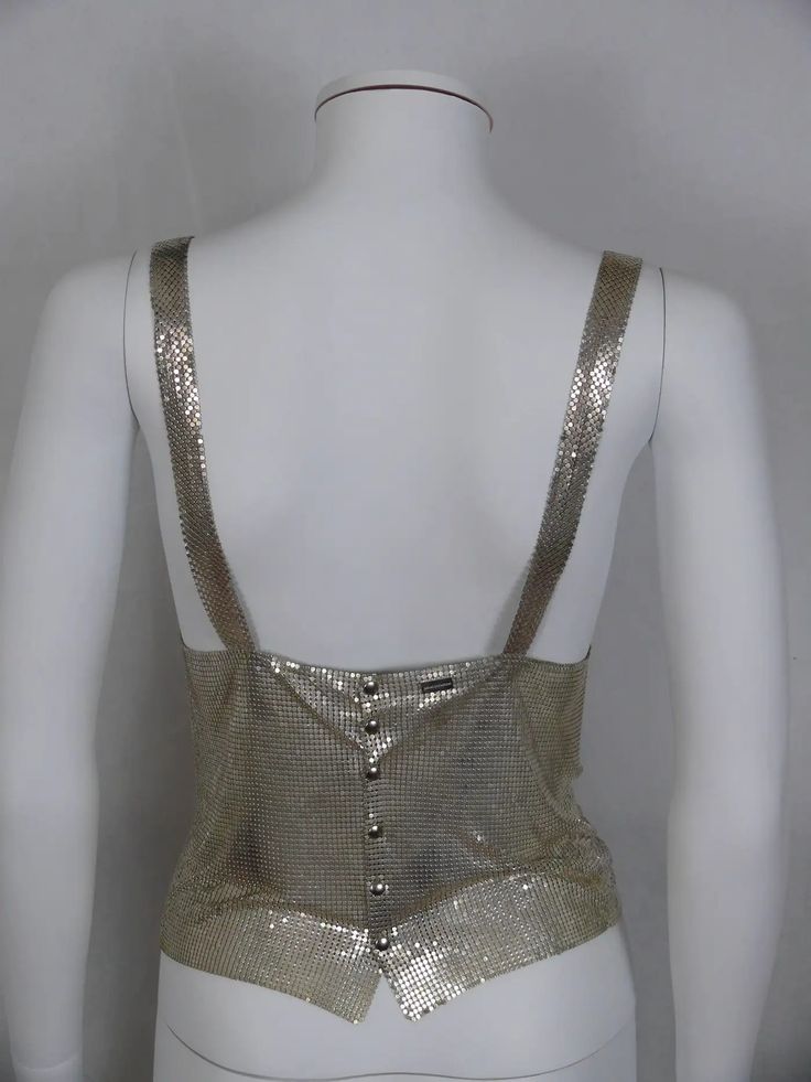 Paco Rabanne Silver Metal Mesh Tank Top For Sale at 1stDibs | silver tank top, metal mesh top, silver mesh top Metallic Fitted Tank Top, Metallic Tank Top For Summer, Silver Fitted Tank Top For Party, Silver Tank Top For Party, Gold Sequined Tank Top For Evening, Metallic Sleeveless Crop Top For Evening, Fitted Silver Sleeveless Crop Top, Fitted Silver Tank Top For Summer, Silver Sleeveless Tank Top For Night Out