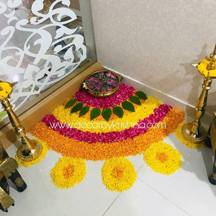 a decorated floor with flowers and candles