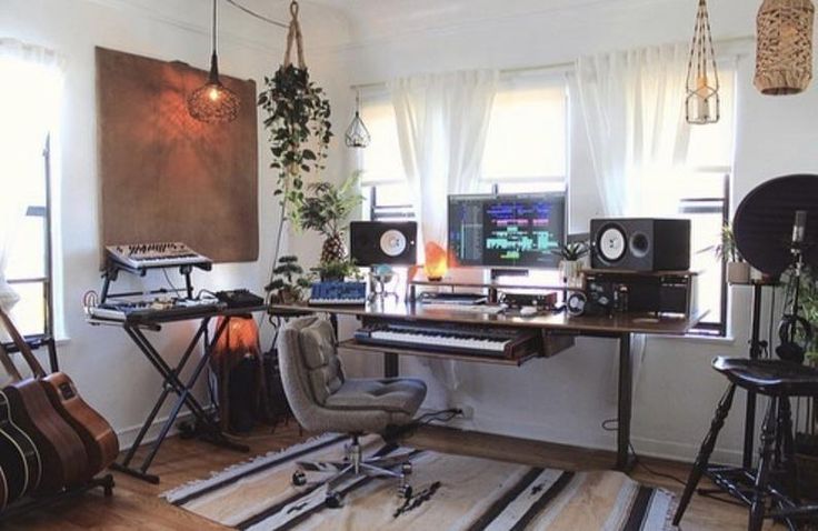 a room filled with lots of musical equipment and plants on the windows sills