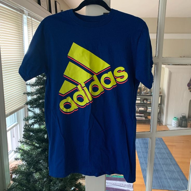 Adidas Blue T-Shirt W/Day Glo Font Size M Never Worn W/Tag Smoke/Pet Free Home In Mint/Excellent/Flawless Condition Wrinkles Will Be Ironed Out On Tumble Dry Blue Adidas T-shirt With Logo, Blue Sports T-shirt With Text Print, Blue Adidas Logo Cotton Top, Blue Sporty Adidas Logo T-shirt, Sporty Blue Adidas Logo T-shirt, Blue Cotton Adidas Logo Tops, Sporty Adidas Blue T-shirt, Blue Graphic Tee With Logo Print, Sporty Blue Shirt With Graphic Print