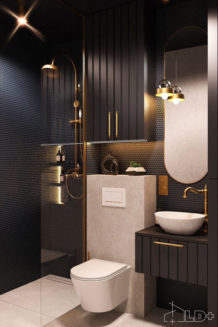 a bathroom with a toilet, sink and shower stall in black and gold color scheme