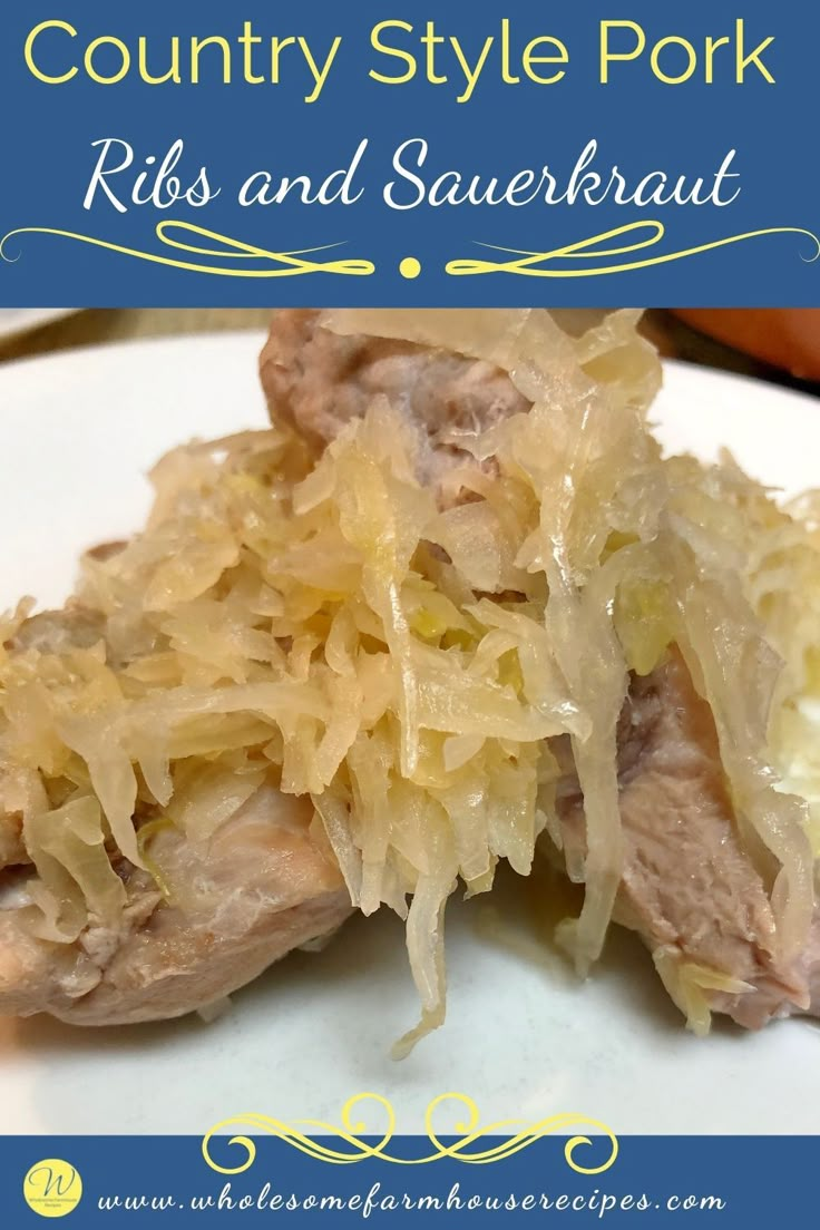 a white plate topped with meat and sauerkraut