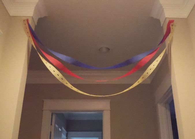 a hallway decorated with red, white and blue streamers