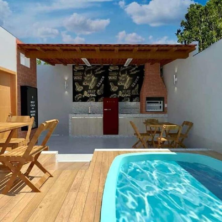 an outdoor kitchen and pool area with chairs