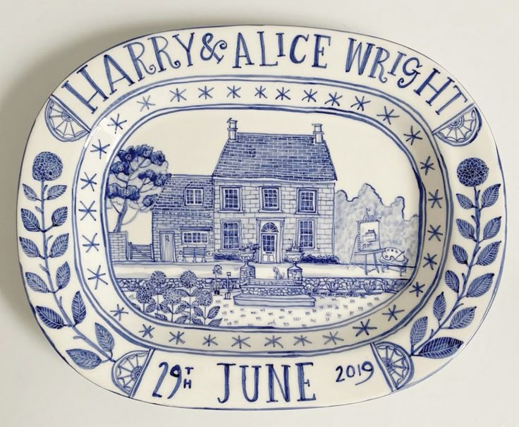 a blue and white plate with the words harry & alice wright on it