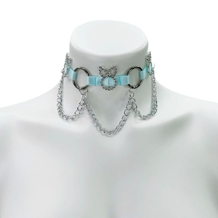 Choose between our glitter elastics or regular elastics to recreate this look to fit your style! Adjustable neck band. Rhinestone charms only available in silver. Light blue elastic, crystal gem, and silver hardware pictured here. Satin Elastic • Adjustable Straps • Hand Wash • Air Dry Adjustable Metal Rhinestone Necklace With Bling, Adjustable Silver Rhinestone Necklace With Bling, Silver Bling Adjustable Choker, Trendy Light Blue Party Jewelry, Trendy Light Blue Jewelry For Party, Adjustable Metal Rhinestone Choker, Adjustable Silver Bedazzled Jewelry, Adjustable Silver Crystal Choker, Adjustable Light Blue Jewelry For Party