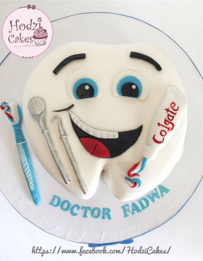 there is a cake that looks like a doctor fadya with toothbrushes on it